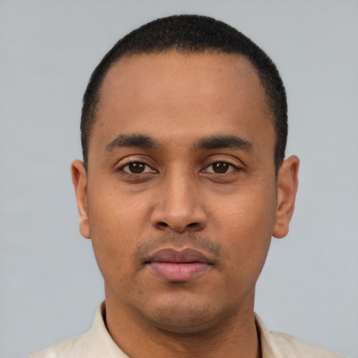Neutral latino young-adult male with short  black hair and brown eyes