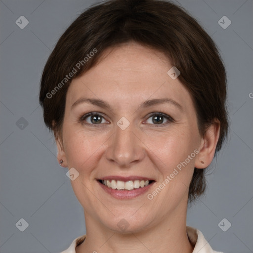 Joyful white adult female with short  brown hair and brown eyes