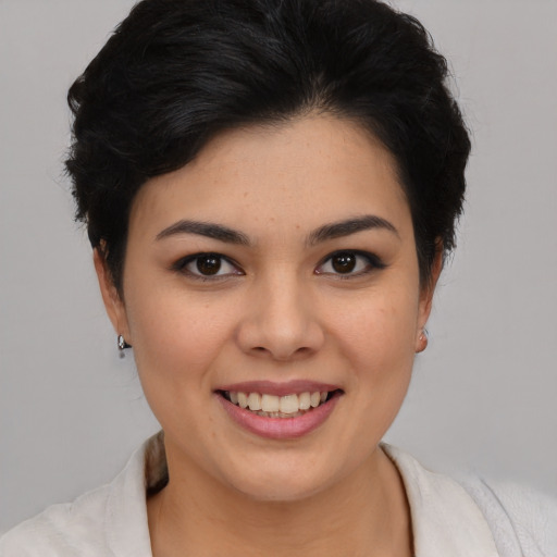 Joyful asian young-adult female with short  black hair and brown eyes