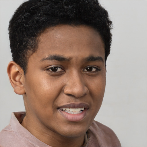 Joyful black young-adult male with short  brown hair and brown eyes
