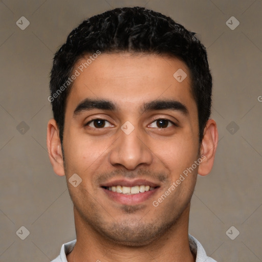 Joyful latino young-adult male with short  black hair and brown eyes