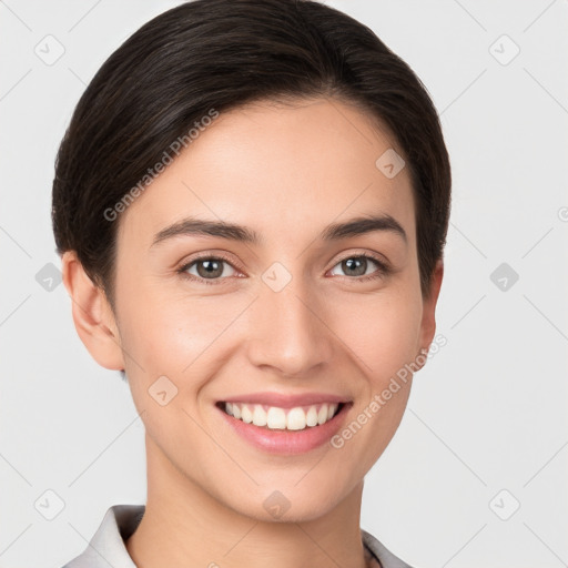 Joyful white young-adult female with short  brown hair and brown eyes