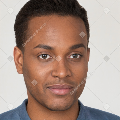 Joyful black young-adult male with short  brown hair and brown eyes