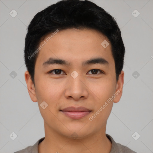 Joyful asian young-adult male with short  black hair and brown eyes