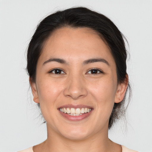 Joyful white young-adult female with medium  brown hair and brown eyes