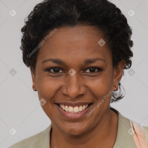 Joyful black adult female with short  brown hair and brown eyes