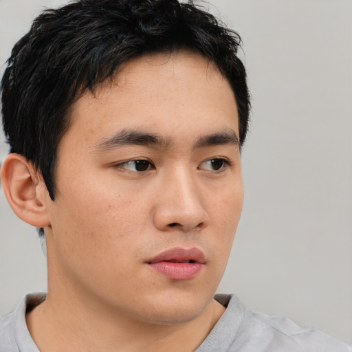 Neutral asian young-adult male with short  brown hair and brown eyes