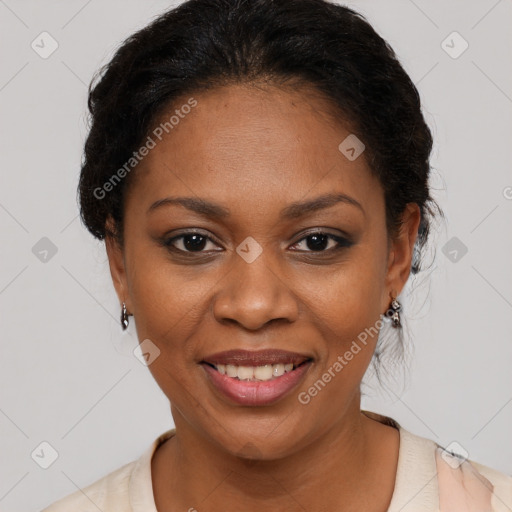 Joyful black adult female with short  brown hair and brown eyes