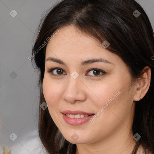 Joyful white young-adult female with medium  brown hair and brown eyes