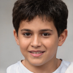 Joyful white child male with short  brown hair and brown eyes