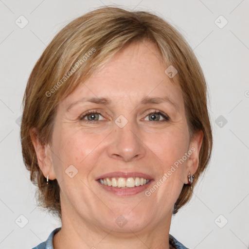 Joyful white adult female with medium  brown hair and grey eyes