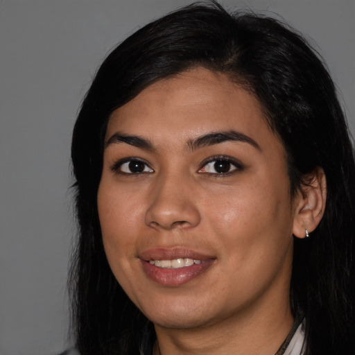 Joyful latino young-adult female with medium  black hair and brown eyes