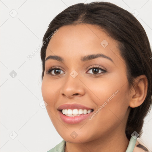 Joyful latino young-adult female with long  brown hair and brown eyes