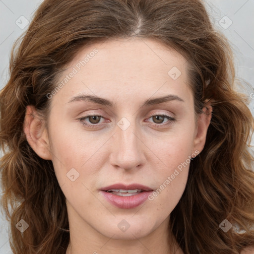 Joyful white young-adult female with long  brown hair and blue eyes