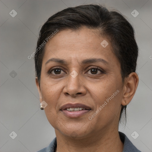 Joyful white adult female with short  brown hair and brown eyes