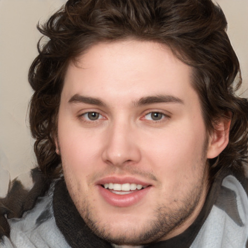 Joyful white young-adult male with medium  brown hair and brown eyes