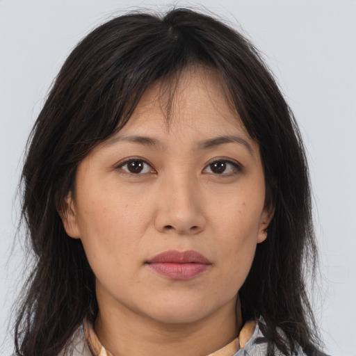 Neutral asian young-adult female with medium  brown hair and brown eyes