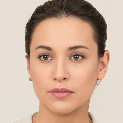 Neutral white young-adult female with short  brown hair and brown eyes