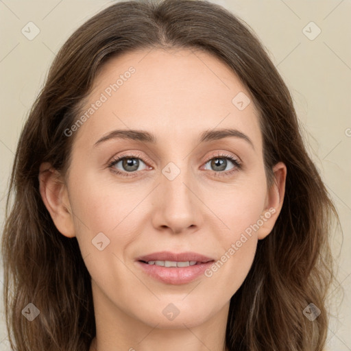 Joyful white young-adult female with long  brown hair and green eyes