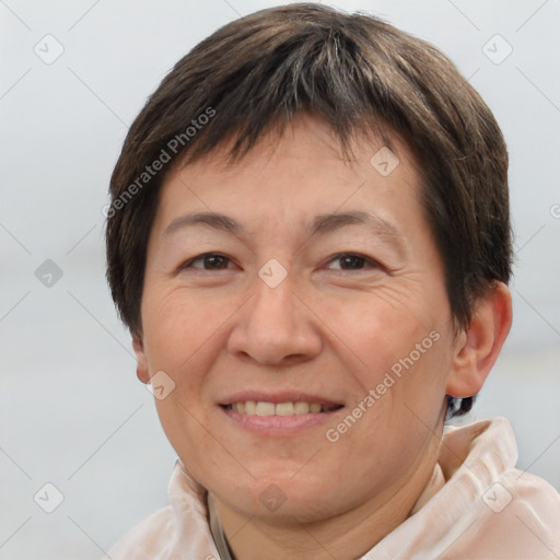 Joyful white adult female with short  brown hair and brown eyes