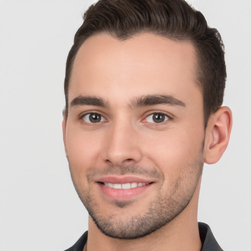 Joyful white young-adult male with short  brown hair and brown eyes