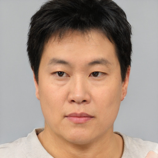 Neutral asian young-adult male with short  brown hair and brown eyes