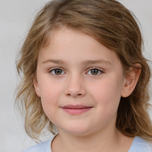 Joyful white child female with medium  brown hair and brown eyes