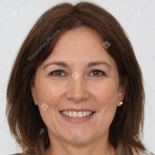 Joyful white adult female with medium  brown hair and brown eyes