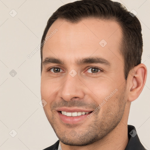 Joyful white young-adult male with short  brown hair and brown eyes