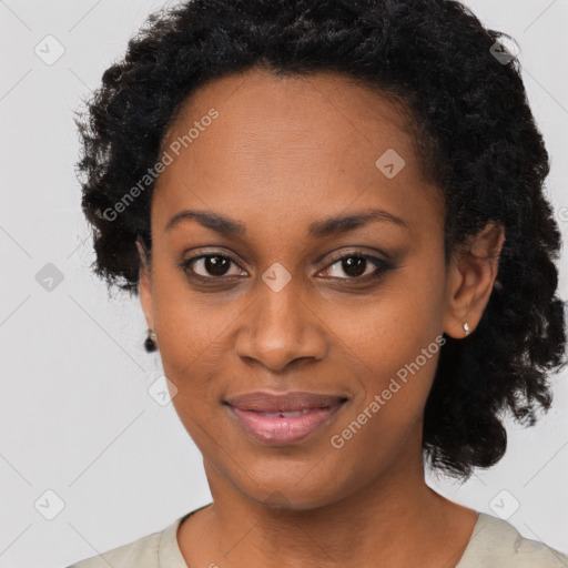 Joyful black young-adult female with short  black hair and brown eyes