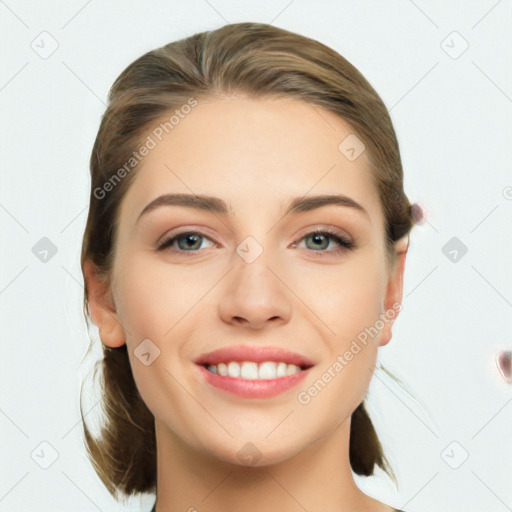 Joyful white young-adult female with medium  brown hair and grey eyes