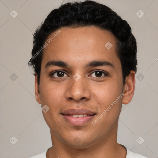 Joyful latino young-adult male with short  black hair and brown eyes