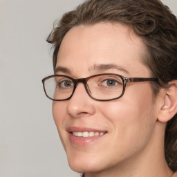 Joyful white adult female with medium  brown hair and blue eyes