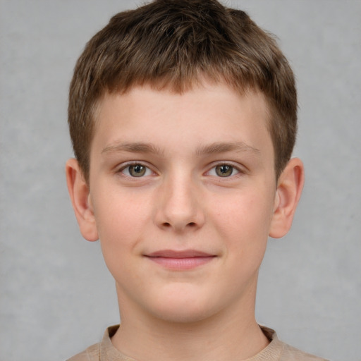 Joyful white child male with short  brown hair and brown eyes