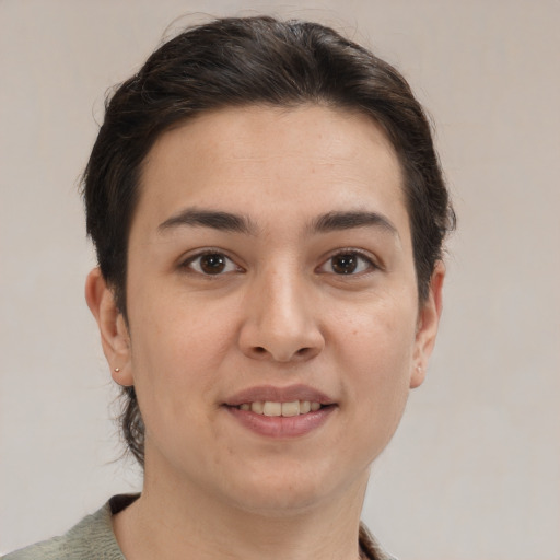 Joyful white young-adult female with short  brown hair and brown eyes