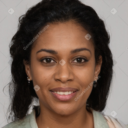 Joyful black young-adult female with long  brown hair and brown eyes