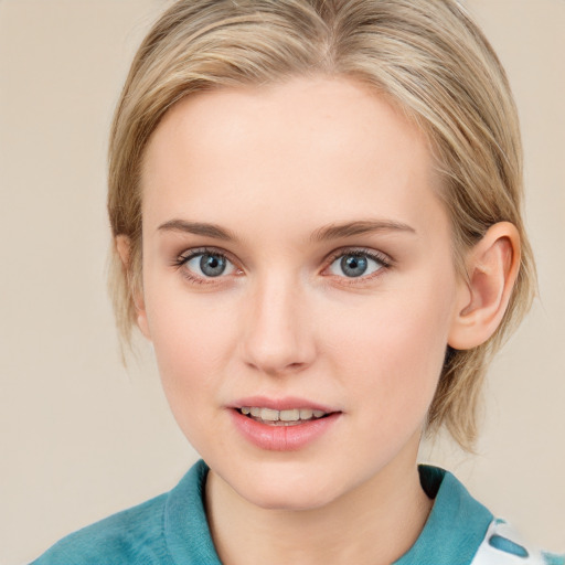 Joyful white young-adult female with medium  brown hair and blue eyes