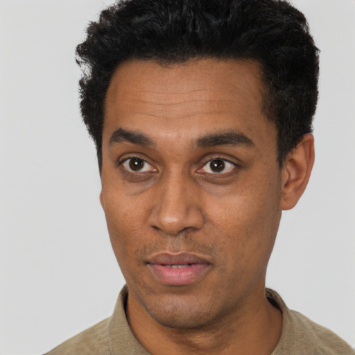 Neutral black adult male with short  black hair and brown eyes