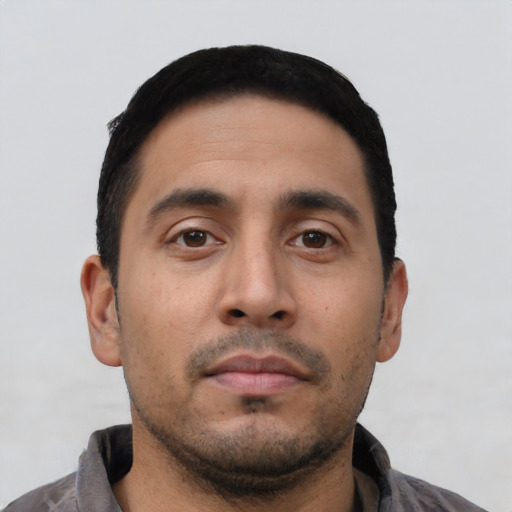 Neutral latino young-adult male with short  black hair and brown eyes