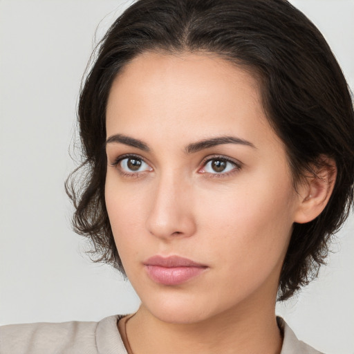 Neutral white young-adult female with medium  brown hair and brown eyes