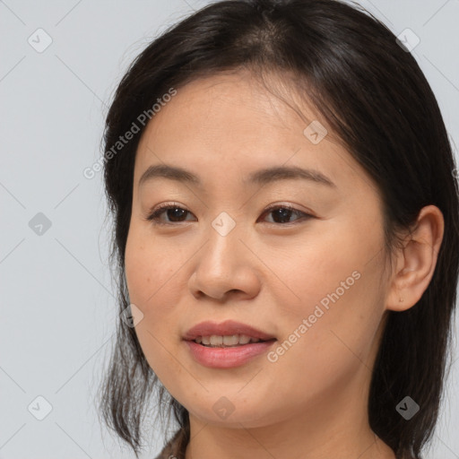 Joyful asian young-adult female with medium  brown hair and brown eyes