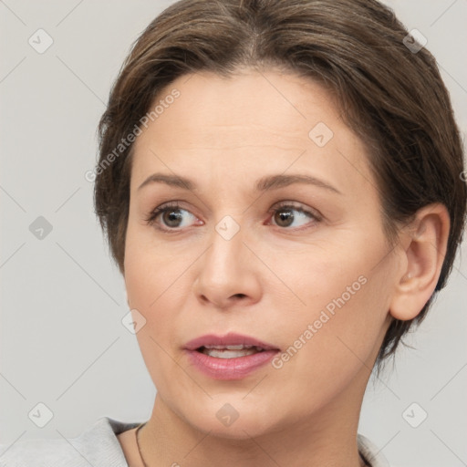 Joyful white adult female with short  brown hair and brown eyes