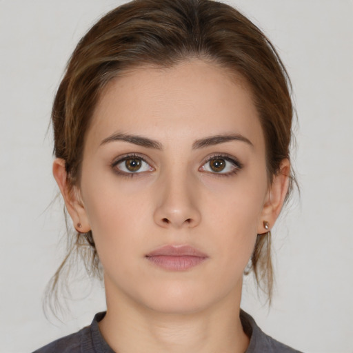 Neutral white young-adult female with medium  brown hair and brown eyes