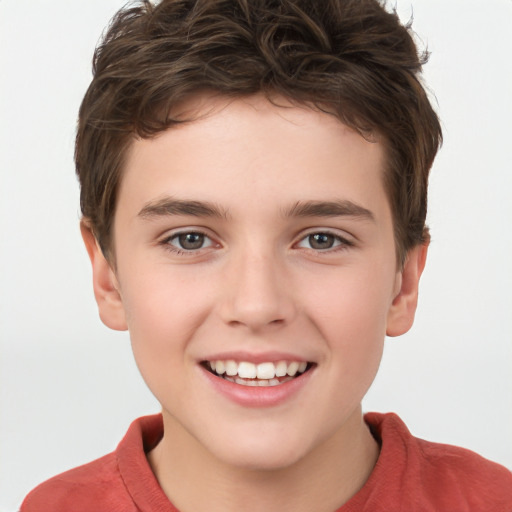 Joyful white child male with short  brown hair and brown eyes