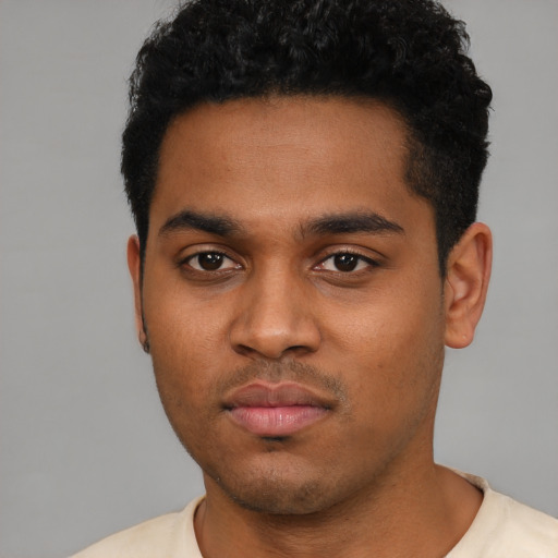 Neutral black young-adult male with short  black hair and brown eyes