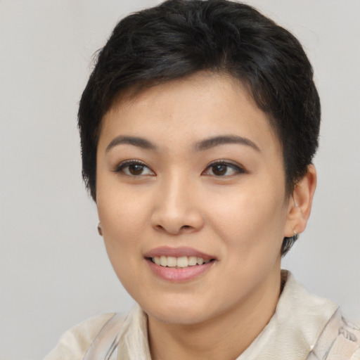 Joyful latino young-adult female with short  brown hair and brown eyes
