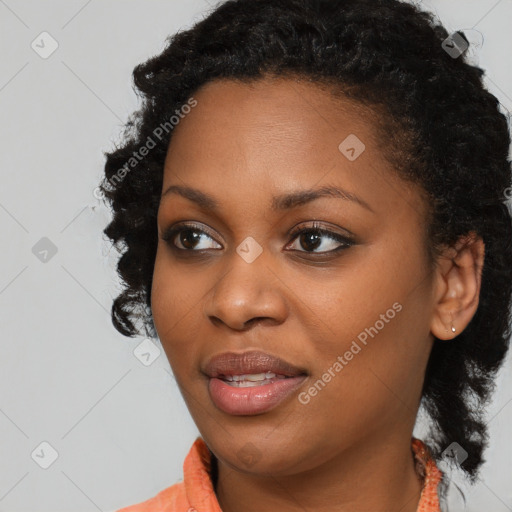 Joyful black young-adult female with medium  black hair and brown eyes