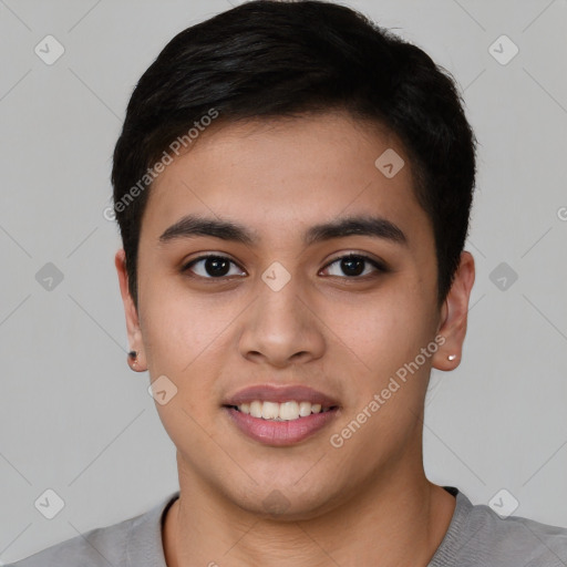 Joyful asian young-adult male with short  black hair and brown eyes