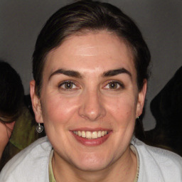 Joyful white adult female with short  brown hair and brown eyes