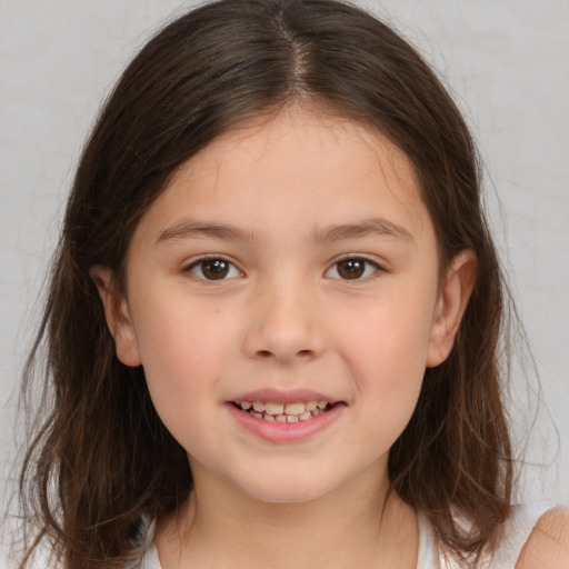 Joyful white child female with medium  brown hair and brown eyes